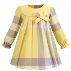 A yellow and gray dress with a bow on the front.