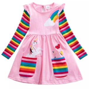 A pink dress with rainbow sleeves and unicorn on it.