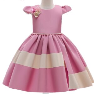 A pink and white dress with a bow on the back.