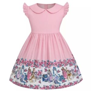 A pink dress with horses and flowers on it.