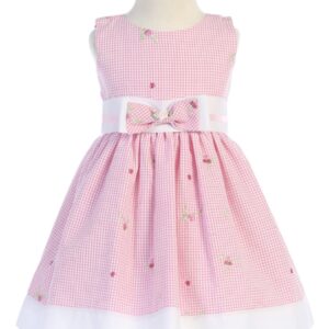 A pink dress with white polka dots and flowers.
